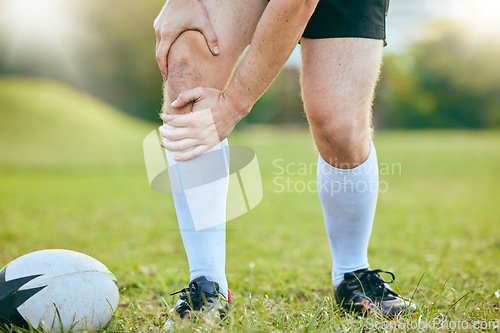 Image of Knee pain, rugby legs and sports person tired, fatigue and sore training accident, match game or challenge on grass field. Body agony, athlete anatomy or closeup of player with medical emergency risk