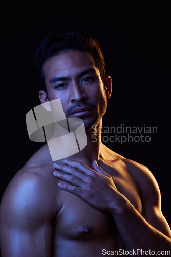 Image of Topless, dark portrait and sexy man on black background in fitness inspiration, beauty aesthetic or bodybuilder fantasy. Healthy, strong body and male model with muscle, studio and neon lighting