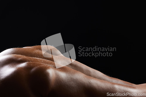 Image of Back, sweat and athlete or skin of man in workout, exercise or body builder with strong, muscle in pushup for health. Dark, background and texture or anatomy of person with fitness from training
