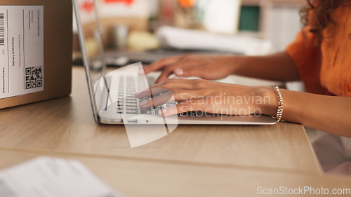 Image of Hands, typing and laptop with boxes, logistics and e commerce in warehouse, workshop and shipping startup. Woman, computer and click for supply chain, store and cardboard package for delivery on desk