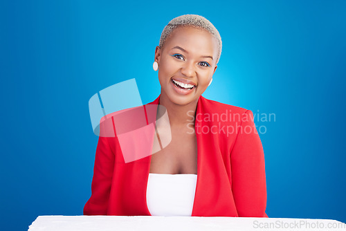 Image of African, entrepreneur and portrait of woman in studio on blue background with confidence of boss in Nigeria startup. Face, smile or happiness of business, employee or corporate entrepreneurship