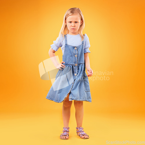 Image of Sad, portrait and girl child in studio with bad news, feedback or negative review on orange background. Face, frown and kid with emoji disappointed expression, angry or tantrum, reaction or behavior