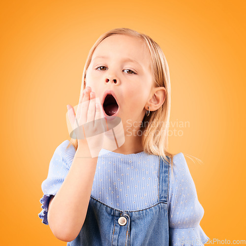 Image of Tired, bored and yawn with portrait of child in studio for fatigue, exhausted and sleepy. Lazy, youth and preschool with face of young girl on orange background for insomnia, nap time and mockup
