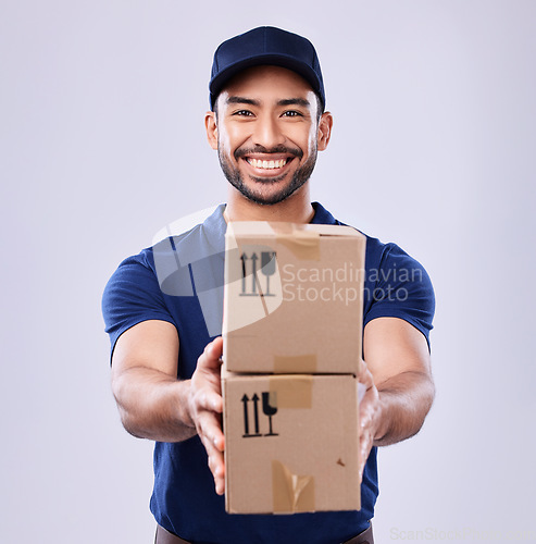 Image of Smile, portrait and delivery man with boxes in studio, safe transport for ecommerce supplier product. Package, logistics and happy courier person on white background for online sales and services.