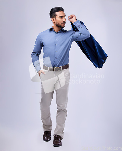 Image of Fashion, confident and business man with jacket in studio for formal, style or attitude on grey background. Fashionable, stylish and male manager in a formal suit with ambitious, mindset or empowered