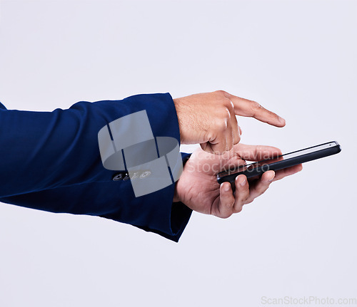 Image of Phone, hands and closeup of man scroll on social media, mobile app or the internet for communication. Technology, networking and male person browsing on a website with cellphone by studio background.