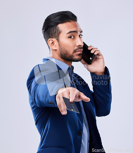 Image of Phone call, credit card and a business man in studio for communication or fintech payment. Serious asian person with smartphone for membership subscription, account or banking info on grey background