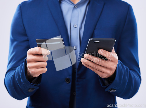 Image of Closeup, hands and a person with a phone and credit card on a studio background for ecommerce. Website, digital or an online customer doing shopping, banking or payment on an easy mobile app