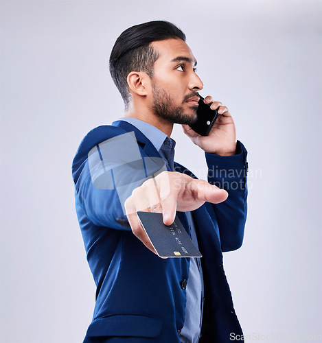 Image of Business man, credit card or phone call in studio for communication or fintech payment. Asian person with smartphone for membership subscription, account authorization or bank info on grey background