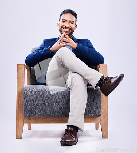 Image of Portrait, confident and business man on chair in studio isolated on a white background. Professional lawyer, consultant and happy attorney, employee and Mexican worker in corporate suit at law firm