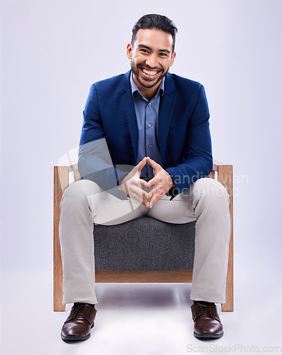 Image of Portrait, happy and business man on chair in studio isolated on a white background. Professional attorney, smile and confident lawyer, legal employee and Mexican worker in corporate suit at law firm.