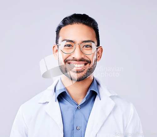 Image of Happy, portrait and man doctor in a studio with glasses for vision, eye care and wellness. Smile, confidence and headshot of an Indian male healthcare professional with spectacles by white background