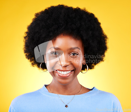 Image of Portrait, smile and young black woman in studio with afro, good mood and cool personality on yellow background. Face of happy, confident and modern African model with pride, curly natural hair or joy