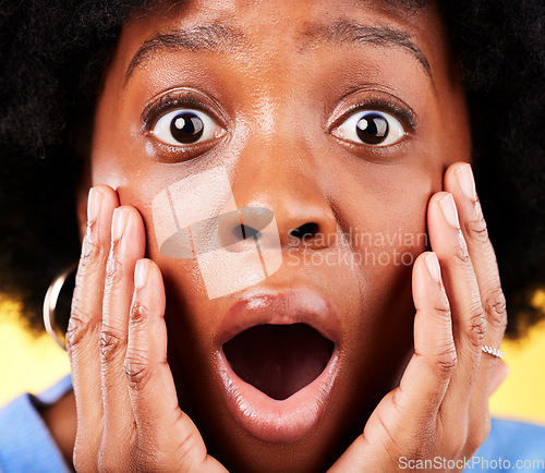 Image of Scared, shock and surprised woman in studio for fear, mental health or closeup. Portrait of African person on yellow background with mouth open, hands on face with a phobia, gossip news or horror