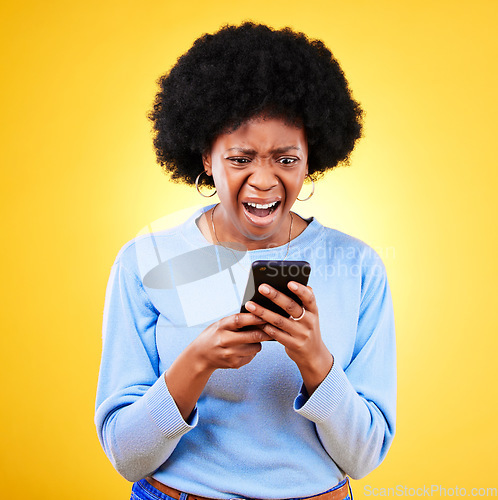 Image of Shock, credit card and woman with phone scam and fraud problem and tech in studio. Stress, mobile error and confused from phishing, hacking and ecommerce spam with anxiety and yellow background