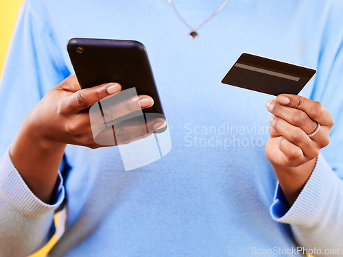 Image of Woman, hands and phone with credit card in online shopping, payment or banking for eft or purchase. Closeup of female person or shopper with debit and mobile smartphone app in ecommerce or buying