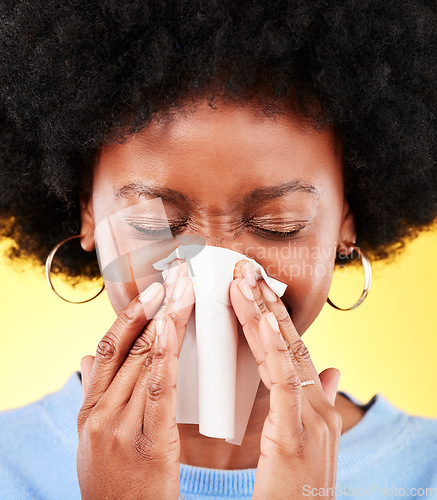 Image of Nose, face and sneeze of sick woman in studio for cold, allergies and medical virus on yellow background. African model, tissue and ill health from sinusitis, allergy and bacteria of winter infection