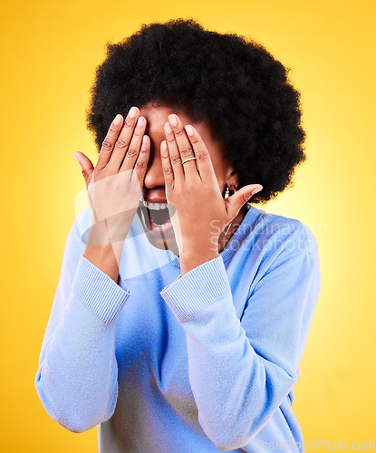 Image of Hands, wow and laughing with an afro black woman on a yellow background in studio for surprise. Smile, bonus and excited with the reaction of a happy young person to good news or a funny joke