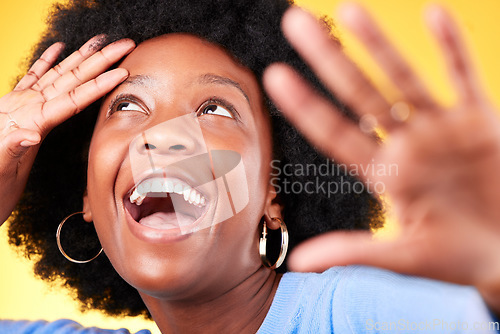 Image of Face, happy and energy with a black woman closeup in studio on a yellow background for excitement. Wow, smile and surprise with a young afro person in celebration as a winner of a bonus or deal