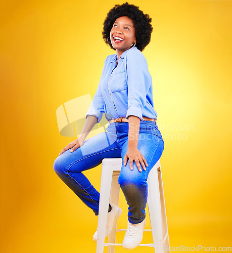 Image of Black woman, smile and thinking on a chair in studio, yellow background or natural happiness with casual fashion and style. African, gen z or model relax with ideas for creative, mockup or space