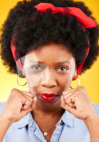 Image of Strong, fight and boxing with portrait of black woman in studio for power, motivation and energy. Empowerment, pride and champion with person and fist on yellow background for challenge and hard work