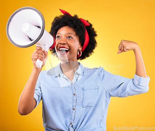 Image of Smile, megaphone and black woman flex arms, motivation and female empowerment on a yellow studio background. African person, girl and model with bullhorn, change and equality with justice and speech