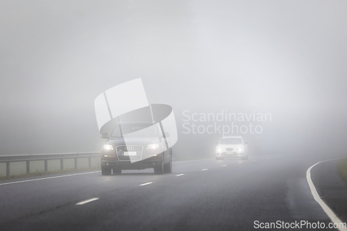 Image of Cars Driving on Highway Through the Fog