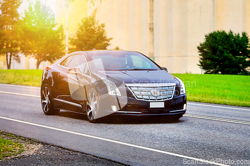 Image of Modern Cadillac Car on Road 