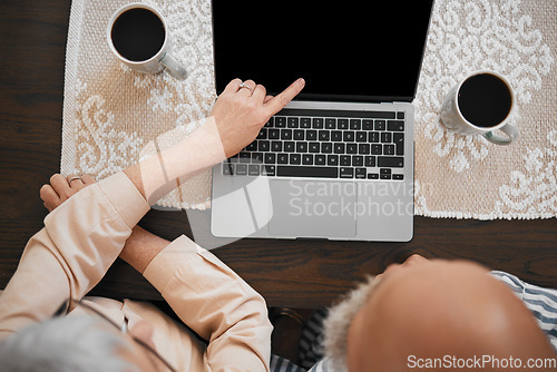 Image of Laptop, couple and hands of woman point at screen on living room table for comic show, internet video or film. Technology, people and watching tv on computer for relax and streaming with coffee