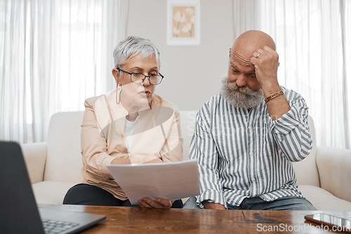 Image of Budget, documents and senior couple with stress planning financial investments, mortgage or tax papers. Elderly woman speaking of bills, debt and pension fund on bank statement to an old man at home