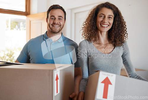 Image of Moving, new home or portrait of happy couple with boxes in real estate, property or rental apartment. Woman, proud man or excited people carrying or lifting package in a house on loan with smile