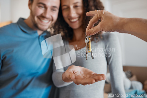 Image of Hand, love or happy couple with house keys in real estate, property investment or buying apartment. New home blur, realtor giving or excited man with smile or woman to celebrate moving in together