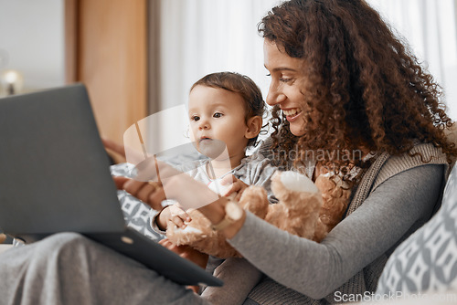 Image of Mother, laptop or child online for education, skills development or knowledge on house sofa. Pointing, talking or baby learning on social media or elearning course at home with mom or single parent