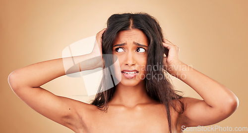 Image of Hair loss, stress and woman with crisis, disaster and hairdresser fail in studio on brown background. Natural, frustration and shocked person, messy and tangled treatment for haircare and girl