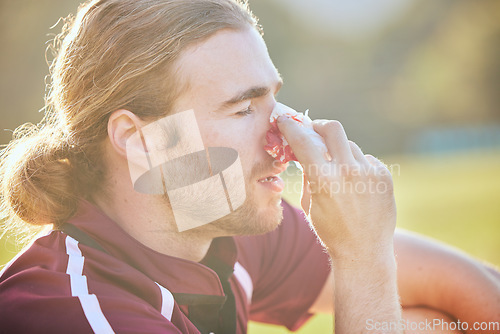 Image of Nose bleed, man closeup and sports injury closeup on field with emergency, health accident and blood outdoor. Swollen, broken and male athlete with medical and pain or bruise after game and exercise