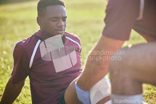 Image of First aid, sport injury and black man with soccer accident, fitness and massage on a field. Training, workout and physical therapy of knee pain at game with healthcare emergency from exercise