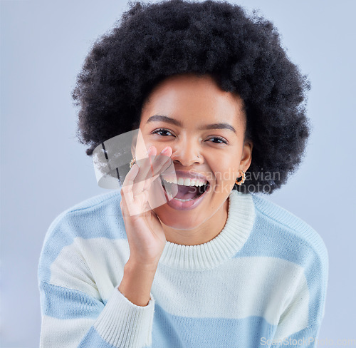 Image of Portrait, announcement and black woman shouting secret in studio isolated on a blue background. Face, smile and person sharing gossip, news or speaking of information for communication of promotion