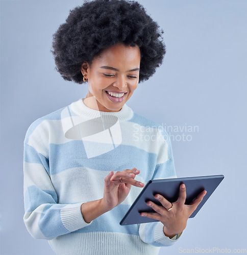 Image of Woman, tablet and smile on studio background for social media post, reading ebook and search website. Happy african model scroll on digital technology for connection, download app and online shopping