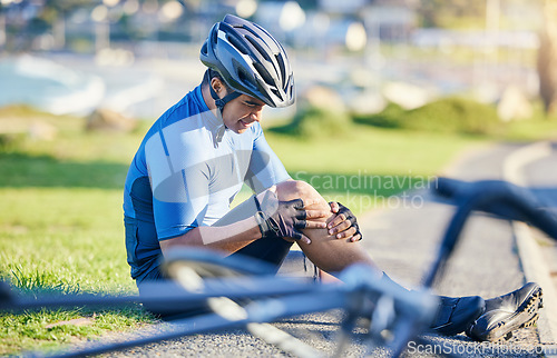 Image of Man, outdoor and biker with knee pain, road and emergency with accident, health issue and fitness. Person, cyclist and athlete with broken leg, inflammation and bruise with medical problem and injury