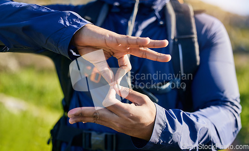 Image of Closeup, hiking and a hand of a person in nature for fitness, training or a sign for exercise. Morning, mountain and an athlete with a gesture for travel, sports or cardio walking or trekking