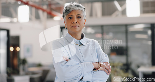 Image of Senior business woman, arms crossed and portrait with leadership, confidence and pride for career. Mature ceo lady, serious face and management job at startup, modern office or professional workplace