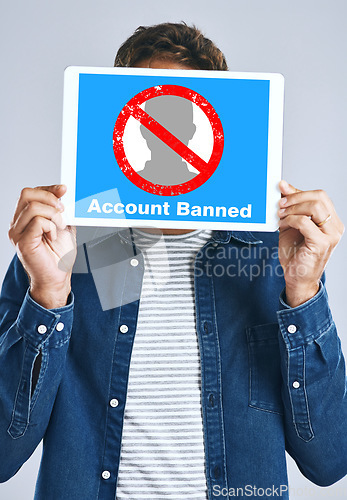 Image of Banned, account and man with a sign for social media, guidelines and rules for online profile and poster in studio background. Internet, ban and person with a banner in hands for virtual exclusion