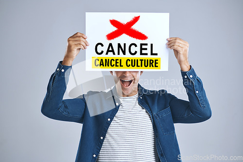 Image of Cancel culture, man and protest sign in hand with message for social media violence and support in studio. Banner, person and mouth with mockup space for solidarity and opinion on grey background