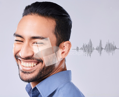 Image of Man, smile and deaf with sound wave overlay on a gray background in studio for communication or listening. Face, happy and audio with the ear of a young person hearing noise translation or connection