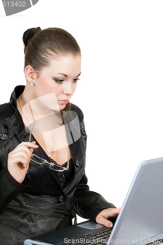 Image of Young businesswoman works on the laptop. Isolated