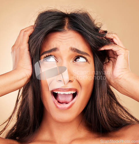 Image of Woman, hair care fail and stress in studio, shouting and thinking for solution by beige background. Girl, model and split end with mistake, frustrated and cosmetics for beauty, aesthetic or wellness