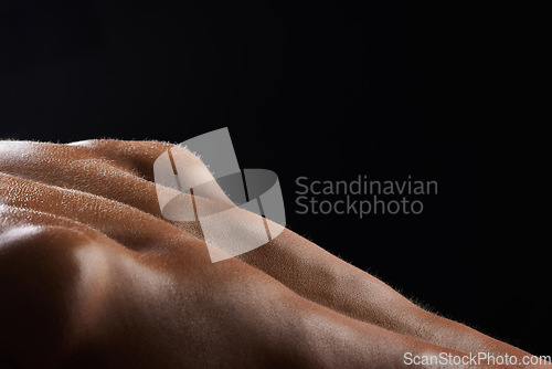 Image of Man, back and sweat on athlete skin in workout, exercise or body builder with strong, muscle in pushup in closeup. Dark, background and texture of anatomy of person with fitness or training in macro