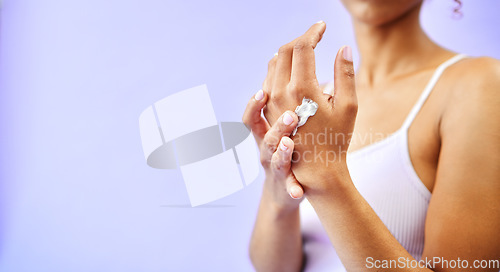 Image of Dry skin, hands and woman with cream for studio skincare, cosmetics or wellness on purple background. Bodycare, beauty or lady model with lotion, dermatology or eczema, acne or treatment application