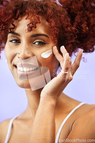 Image of Skincare, studio portrait or happy woman with cream, self care results or SPF sunscreen, lotion or skin hydration. Facial routine, face cosmetics or person with dermatology creme on purple background