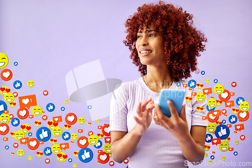 Image of Phone, social media and emoji notification with a black woman in studio on a purple background for communication. Mobile, app and reaction with a happy young person using technology to like a post